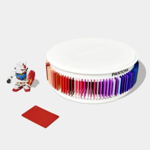 carousel of multi coloured Pantone plastic colour plaques and plastic figurine